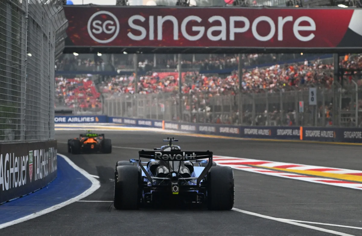 Nico Hulkenberg leaving the pit lane behind a McLaren F1 car during FP1 at the 2026 Singapore Grand Prix.